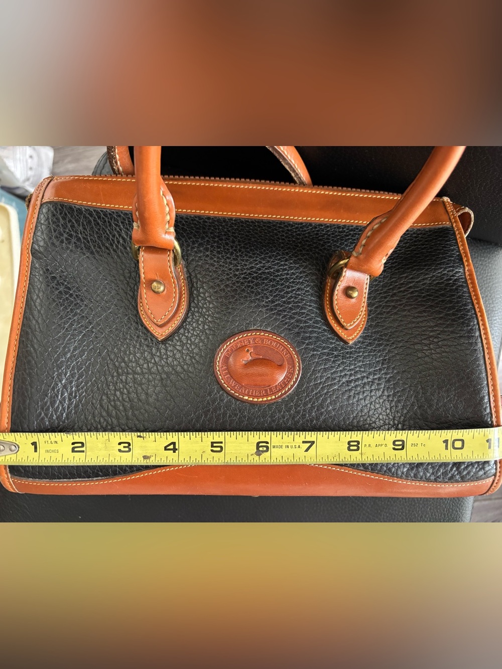 Dooney & Bourke Black Leather Satchel with Brown Trim